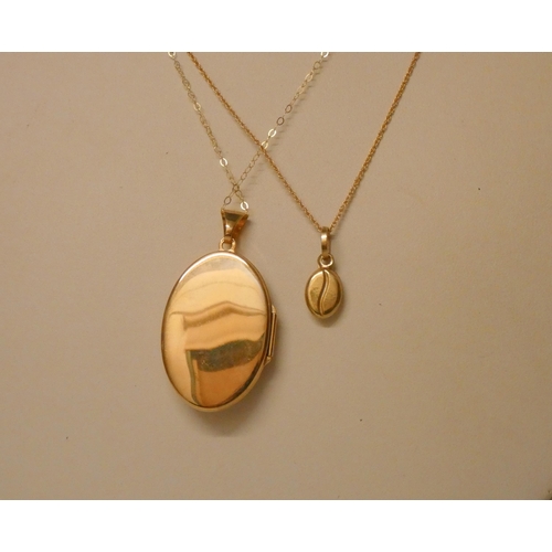 544 - 9ct gold coffee bean pendant on chain and a large oval 9ct gold locket on chain. Gross weight 6.5g