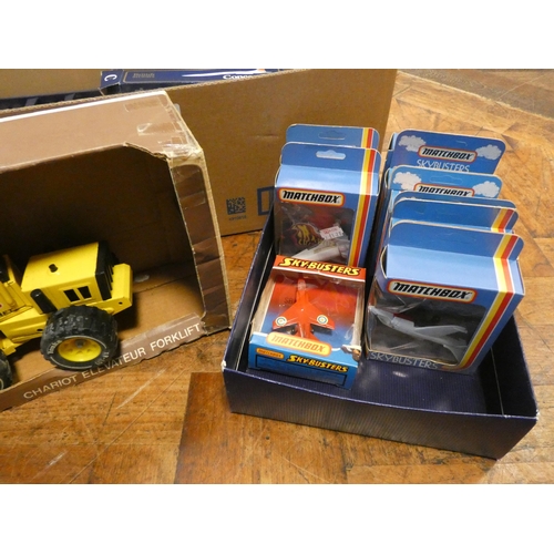 669 - Large quantity of played with model vehicles to include miniature Tonka tractors, and 8 Matchbox Sky... 