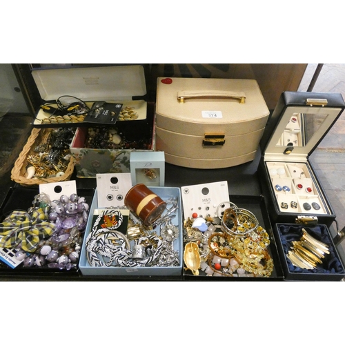 674 - Costume jewellery - earrings, beads etc in 5 large jewellery boxes