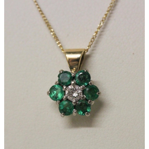 507 - An emerald and diamond pendant on fine 9ct gold chain. Gross weight 2.4g