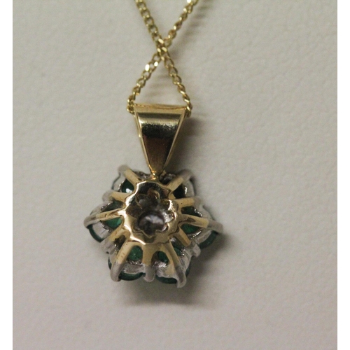 507 - An emerald and diamond pendant on fine 9ct gold chain. Gross weight 2.4g