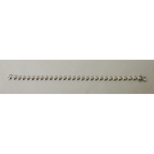 537 - A modern 18ct white gold diamond tennis bracelet, diamond weight 1.5 carats, gross weight 12.7g, 18c... 