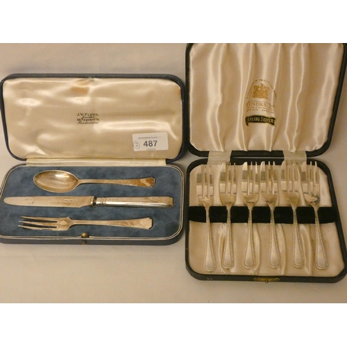 487 - A cased set of six silver pastry knives and a boxed silver christening cutlery set. Weighable silver... 