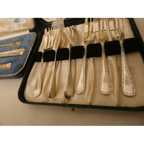 487 - A cased set of six silver pastry knives and a boxed silver christening cutlery set. Weighable silver... 