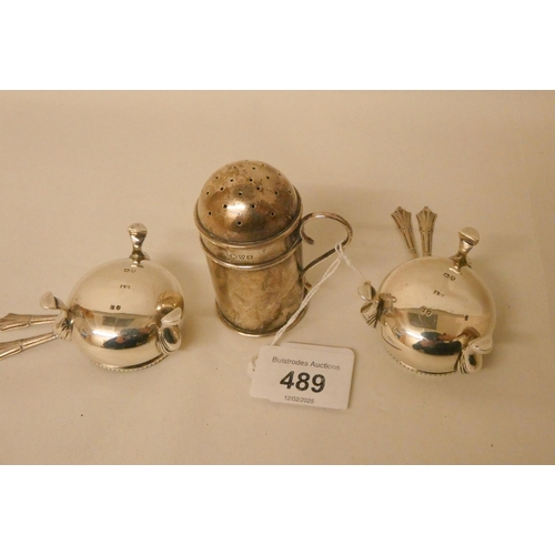 489 - A silver pepper shaker and a pair of Victorian silver salt cellars with blue glass liners, and four ... 