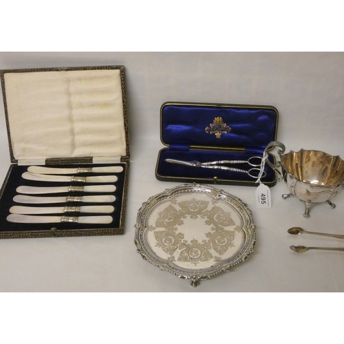 495 - A silver plated card waiter, sauce boat, two cases of mother of pearl handled tea knives, chamber st... 