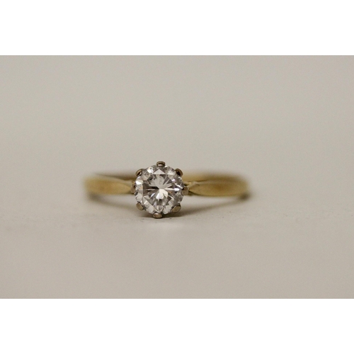 517 - A solitaire diamond engagement ring, the claw set brilliant cut diamond on  hallmarked 18ct yellow g... 