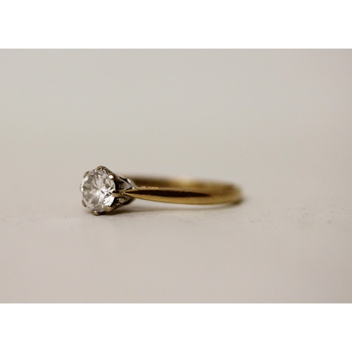 517 - A solitaire diamond engagement ring, the claw set brilliant cut diamond on  hallmarked 18ct yellow g... 