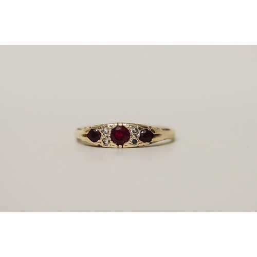 523 - A ruby and diamond ring, in the Victorian style on hallmarked 9ct gold band. Ring size N, 2.3g