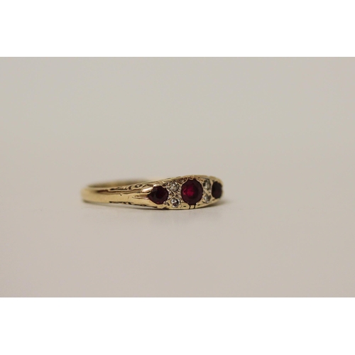 523 - A ruby and diamond ring, in the Victorian style on hallmarked 9ct gold band. Ring size N, 2.3g