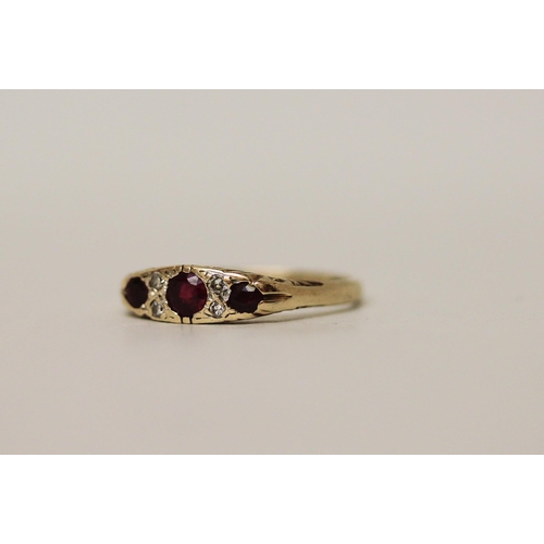 523 - A ruby and diamond ring, in the Victorian style on hallmarked 9ct gold band. Ring size N, 2.3g