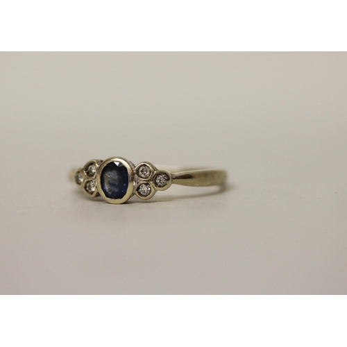 529 - A 9ct gold sapphire and diamond dress ring. Shank misshapen, ring size L approx. 2.4g