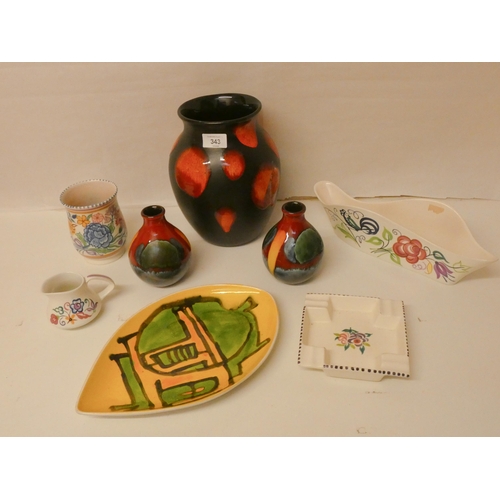 343 - Poole Pottery - a collection to include traditional floral wares and later Delphis pieces.