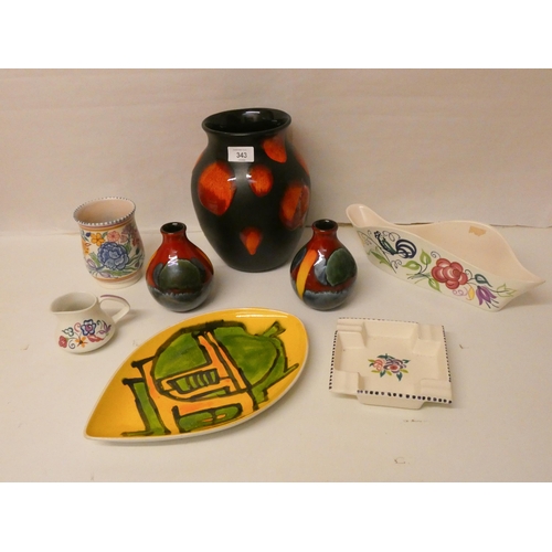 343 - Poole Pottery - a collection to include traditional floral wares and later Delphis pieces.