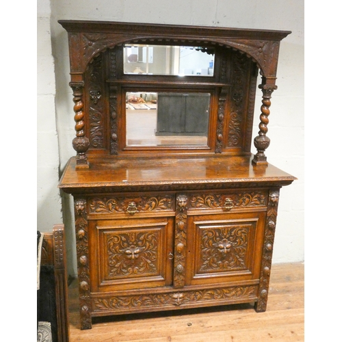 1 - A Victorian carved oak sideboard with mirrored back and barley twist columns, drawers and cupboards ... 