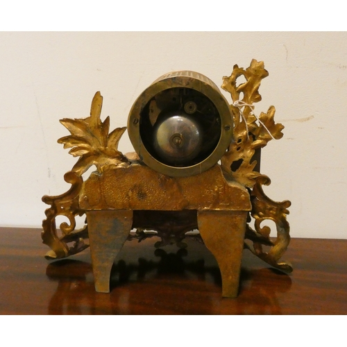 4 - A French striking mantel clock in decorative gilt metal case