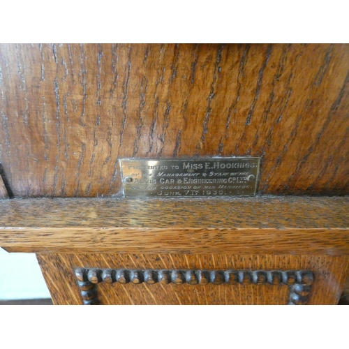 58 - A striking Grandmother clock in oak case with barley twist columns