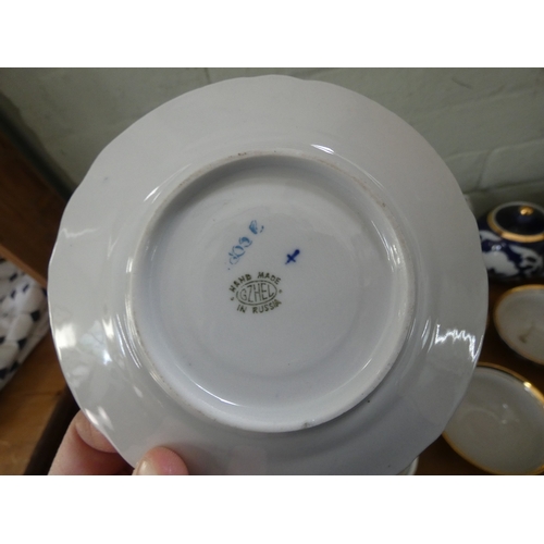 61 - A collection of assorted blue and white china and three wall plates