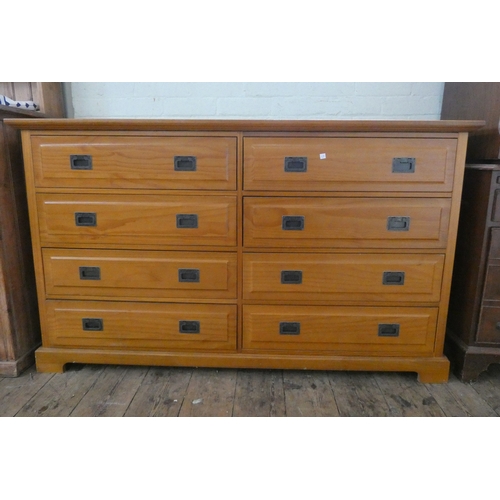 62 - A modern teak effect chest of eight drawers with military style handles, 5' wide