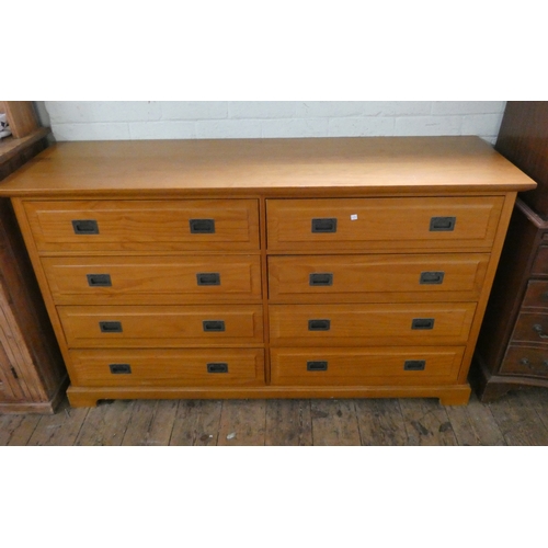 62 - A modern teak effect chest of eight drawers with military style handles, 5' wide