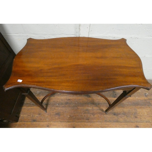 7 - A shaped Edwardian inlaid mahogany occasional table with decorative stretcher base