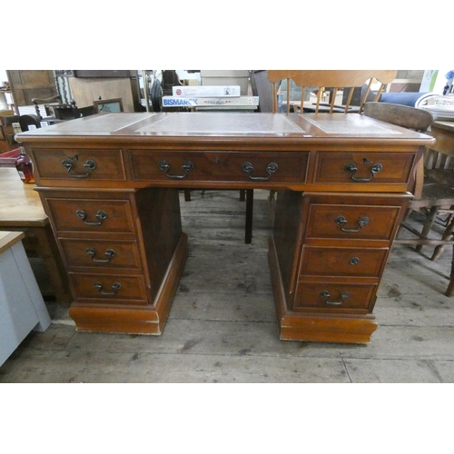 73 - A Georgian style yew wood kneehole office desk with leather top, 4' wide