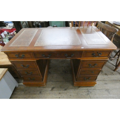 73 - A Georgian style yew wood kneehole office desk with leather top, 4' wide