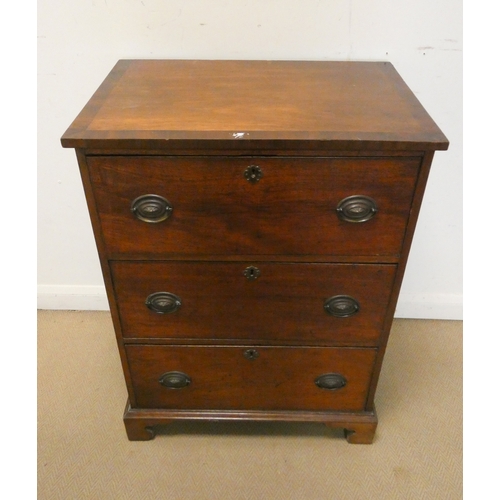 9 - A late Georgian mahogany secretaire chest of three long drawers standing on bracket feet with cross ... 