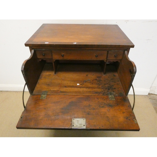 9 - A late Georgian mahogany secretaire chest of three long drawers standing on bracket feet with cross ... 