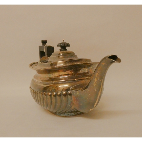 400 - A late Victorian silver teapot, of half lobed form, with ebony handle. Chester 1899, 18 oz troy all ... 