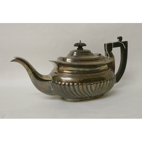 400 - A late Victorian silver teapot, of half lobed form, with ebony handle. Chester 1899, 18 oz troy all ... 