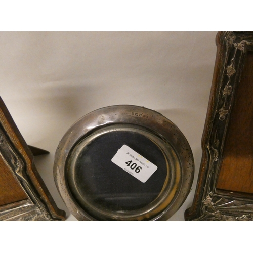 406 - A collection of four assorted silver photograph frames and a silver thimble