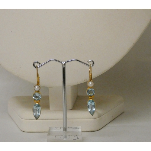 422 - A long row of cultured pearls with 9ct gold clasp, a pair of blue topaz and silver gilt earrings and... 