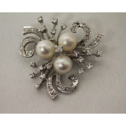 432 - A vintage diamond and pearl spray brooch, of triform shape set with three cultured pearls, set in un... 