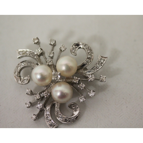 432 - A vintage diamond and pearl spray brooch, of triform shape set with three cultured pearls, set in un... 