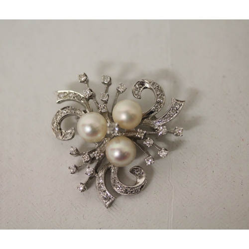 432 - A vintage diamond and pearl spray brooch, of triform shape set with three cultured pearls, set in un... 