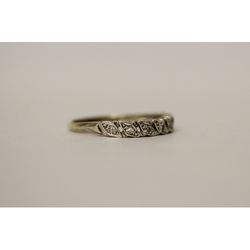 446 - A 9ct white gold diamond band, hallmarked, ring size Q. Gross weight 2.4g