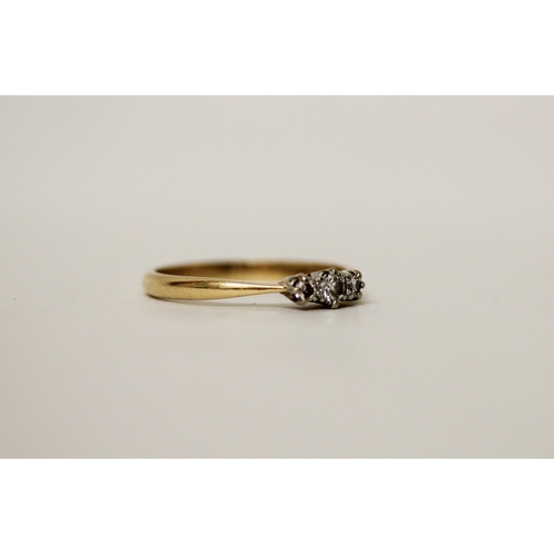 447 - A vintage three stone diamond ring, on 18ct yellow gold band. Ring size R/S, 2.9g