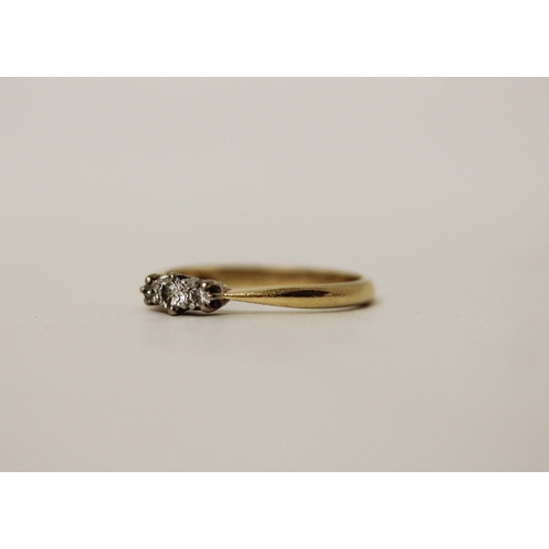 447 - A vintage three stone diamond ring, on 18ct yellow gold band. Ring size R/S, 2.9g