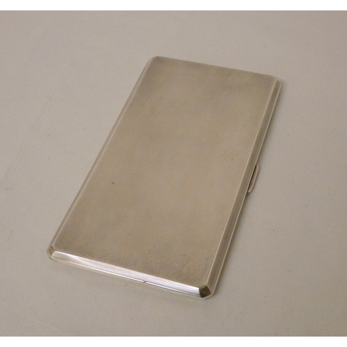 437 - A silver engine turned large double cigarette case, with 1950's presentation engraving to the inner ... 