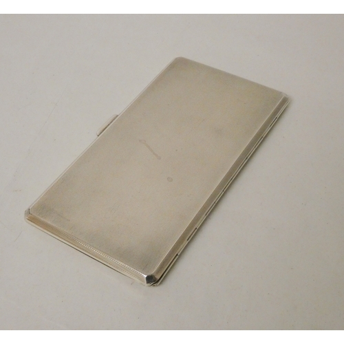 437 - A silver engine turned large double cigarette case, with 1950's presentation engraving to the inner ... 