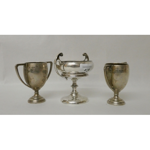 439 - A collection of three hallmarked silver trophy cups, gross weight 6.8 troy ounces