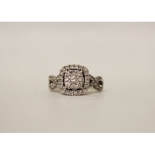 444 - A modern diamond cluster ring in a square setting to cross over diamond shoulders, hallmarked, ring ... 