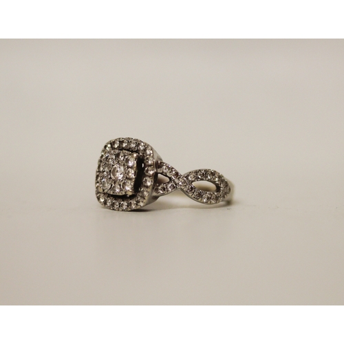 444 - A modern diamond cluster ring in a square setting to cross over diamond shoulders, hallmarked, ring ... 