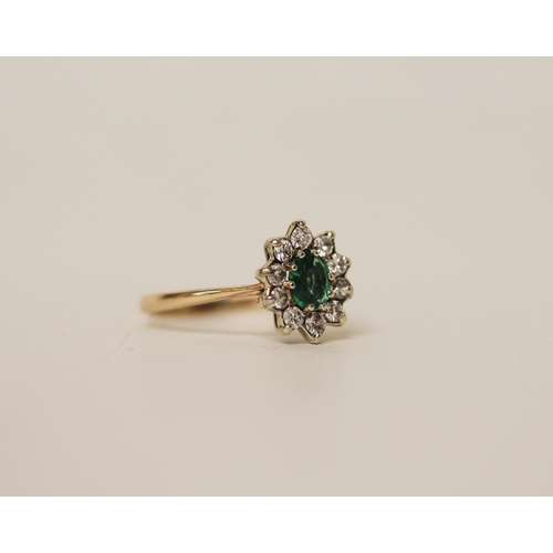 454 - A 9ct gold oval emerald and diamond cluster ring, ring size L, 1.6 grams