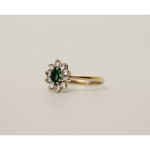 454 - A 9ct gold oval emerald and diamond cluster ring, ring size L, 1.6 grams