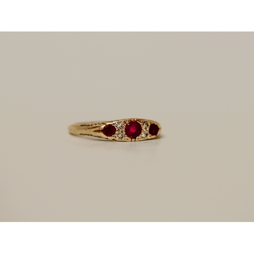 459 - A three stone ruby and diamond Victorian style ring on a 9ct gold band, ring size M, 2.1 grams