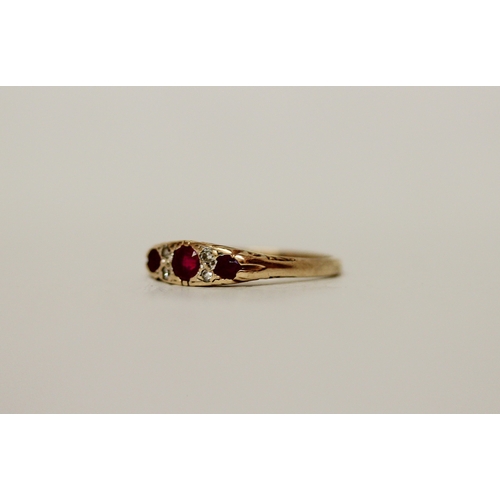 459 - A three stone ruby and diamond Victorian style ring on a 9ct gold band, ring size M, 2.1 grams