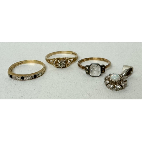 411 - Two 9ct gold stone set rings, an opal cluster pendant and a silver gilt dress ring. Gold rings weigh... 