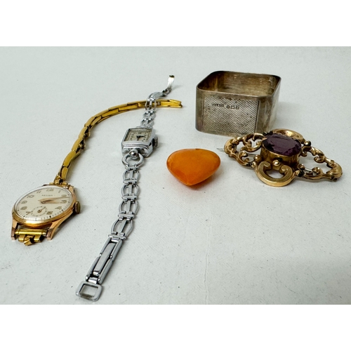 412 - An antique brooch, butterscotch amber heart shaped pendant, a silver napkin ring and two dress watch... 